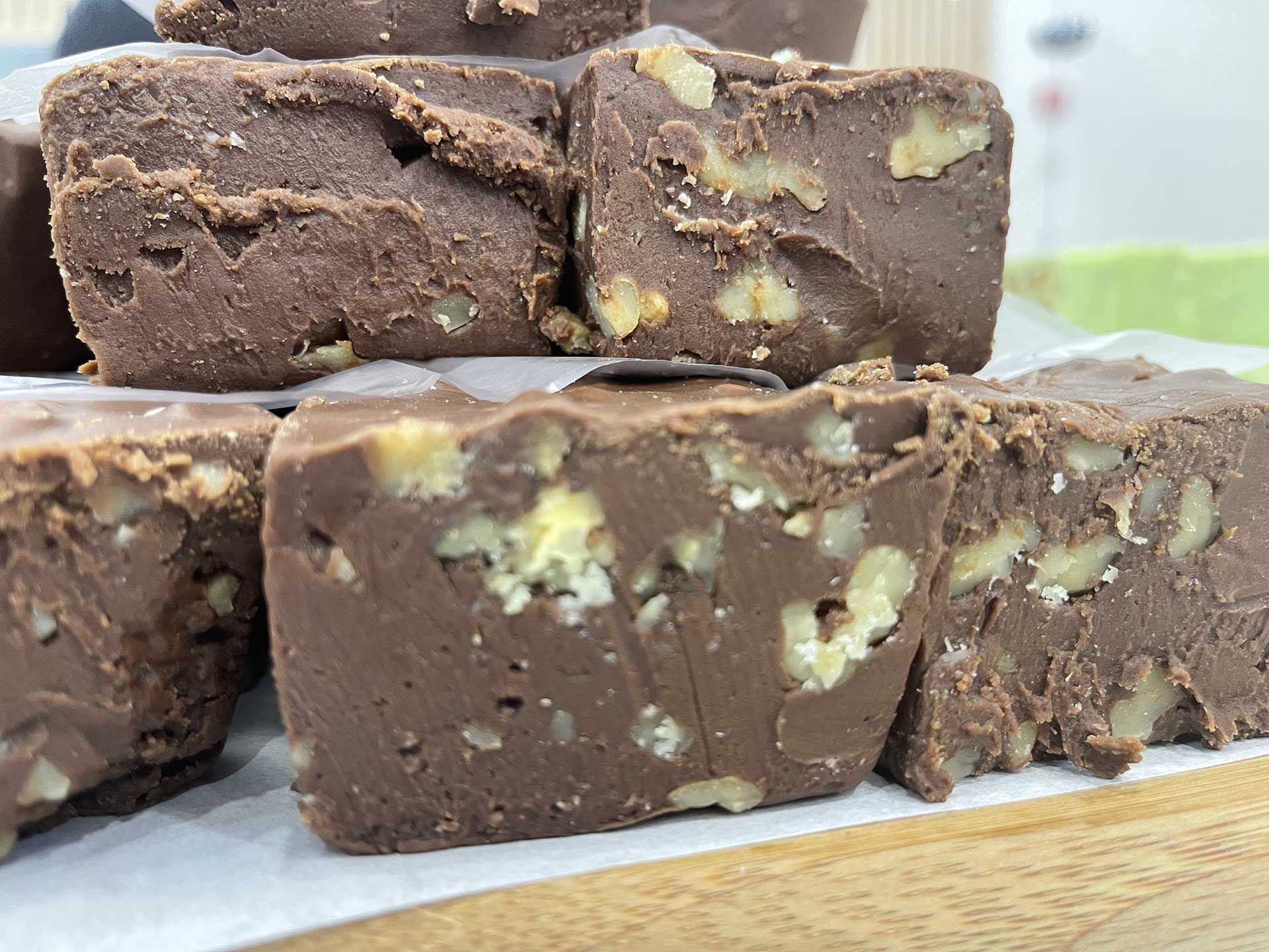 Chocolate fudge squares with walnut pieces.