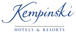 A blue logo for kempinski hotels and resorts