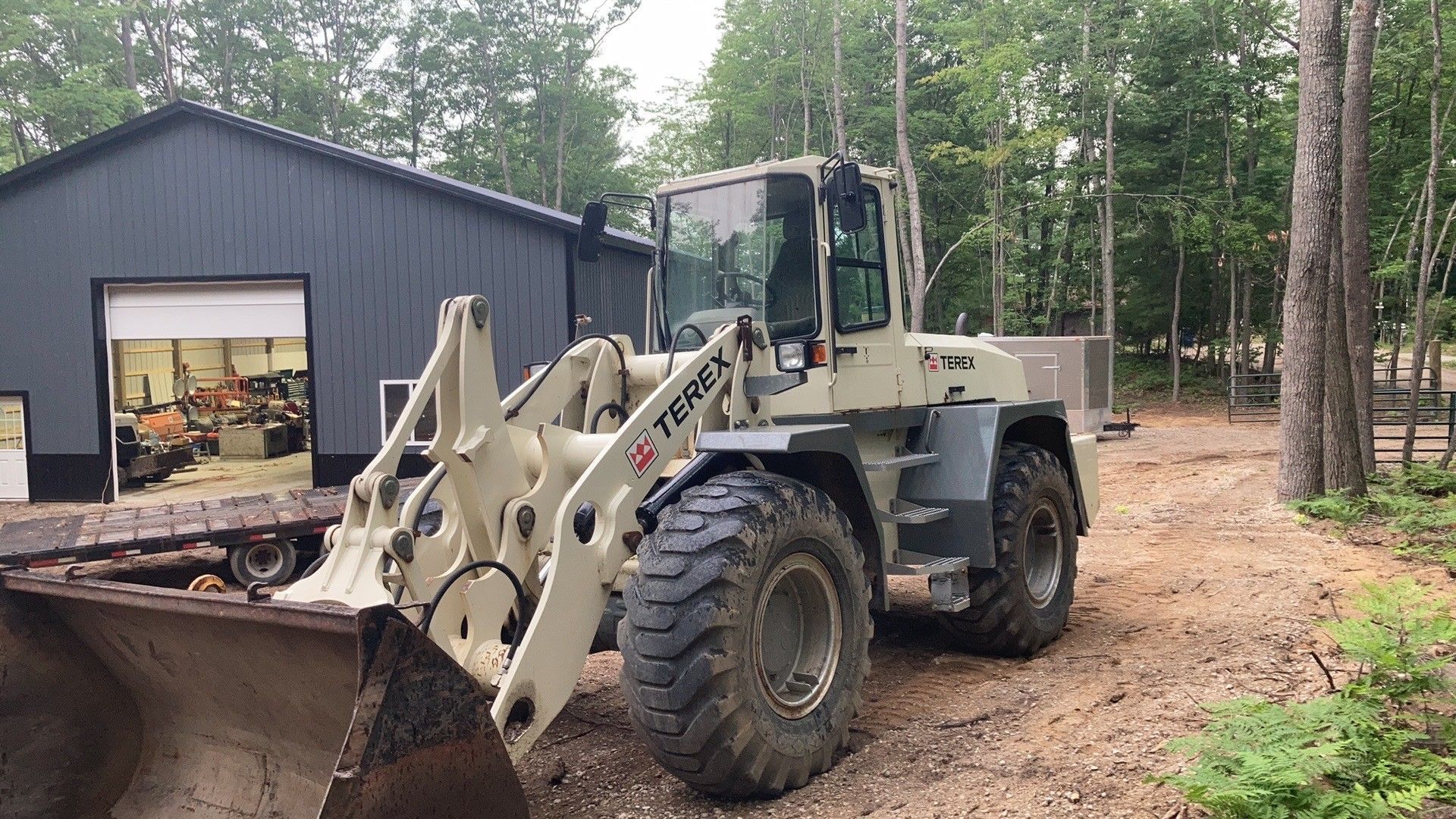 A bulldozer is parked in front of a building.
