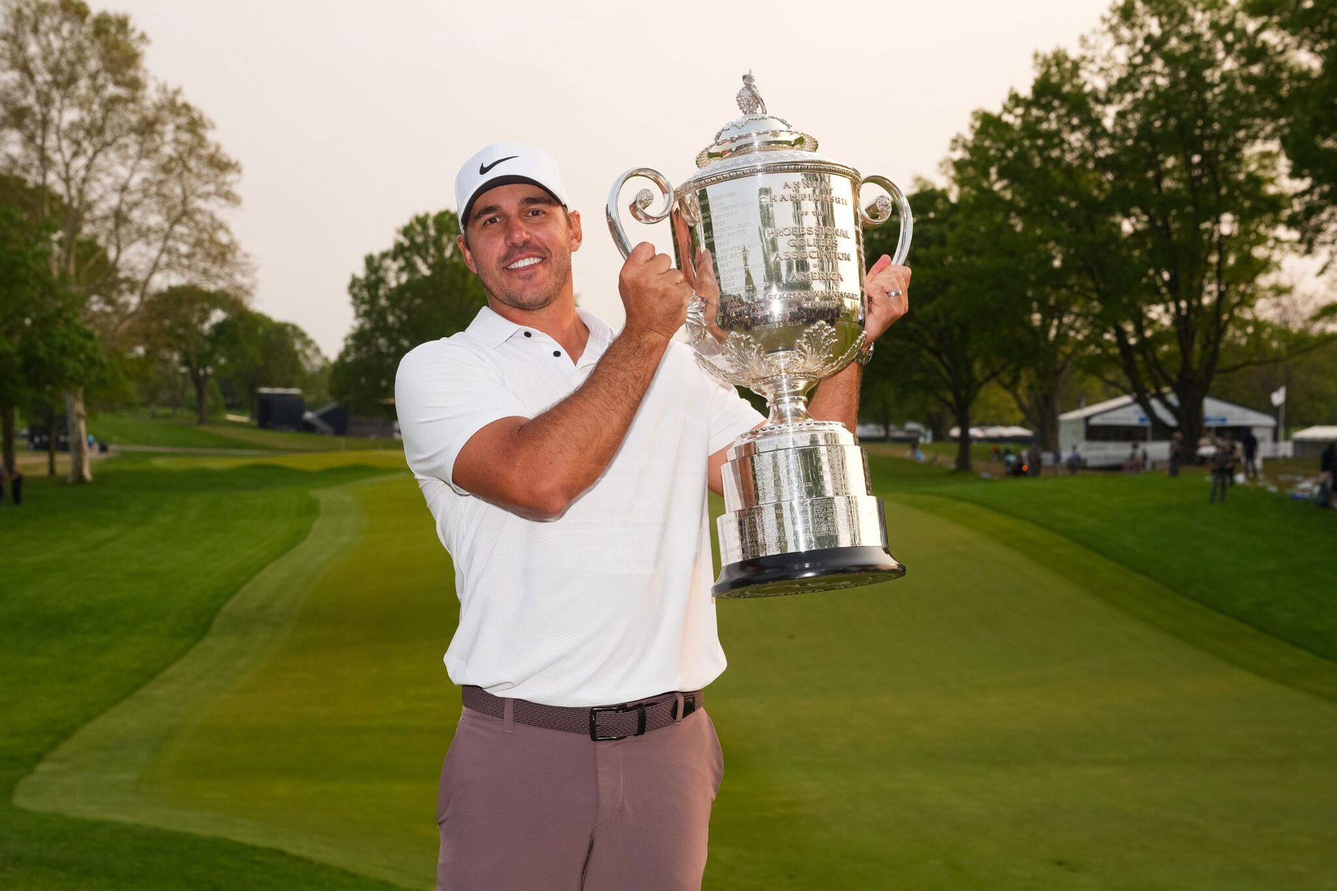 Brooks Koepka holding the PGA Championship trophy.