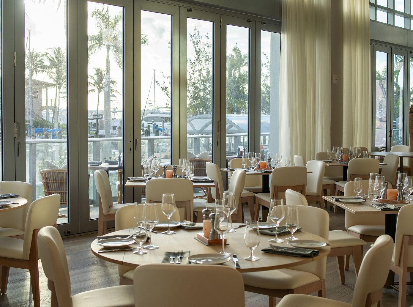 Five people holding framed American flags with thin blue lines at an event labeled