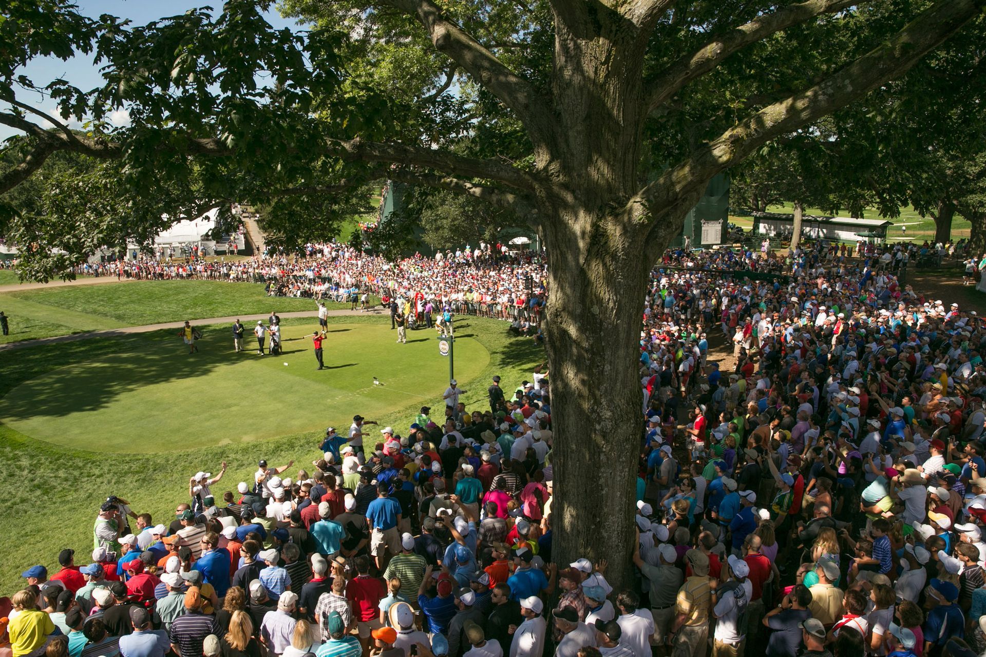 Five people holding framed American flags with thin blue lines at an event labeled
