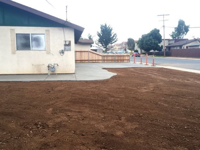 A house with a lot of dirt in front of it