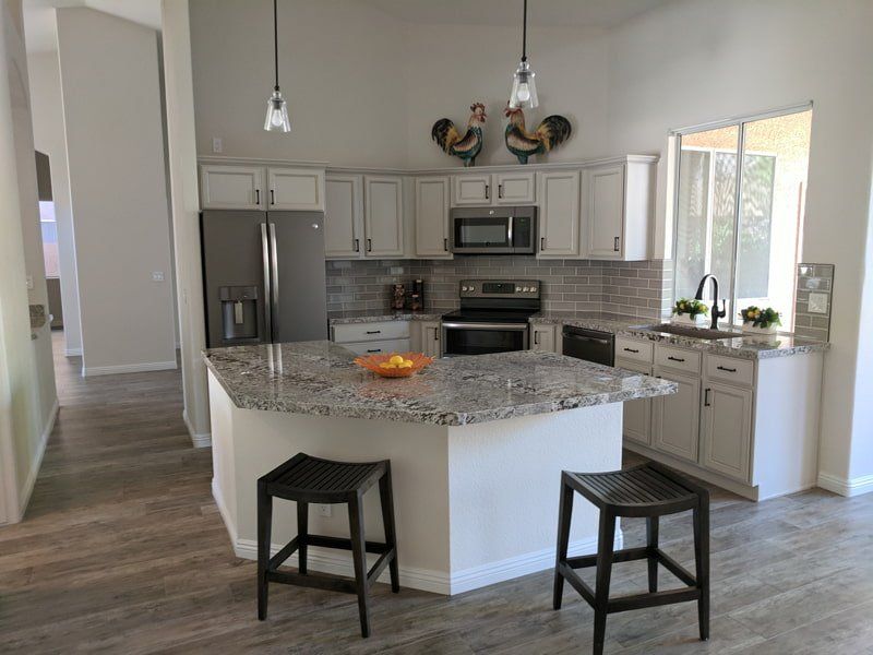 open kitchen with granite counter tops