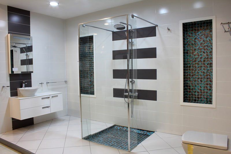 walk in shower in front of design in wall
