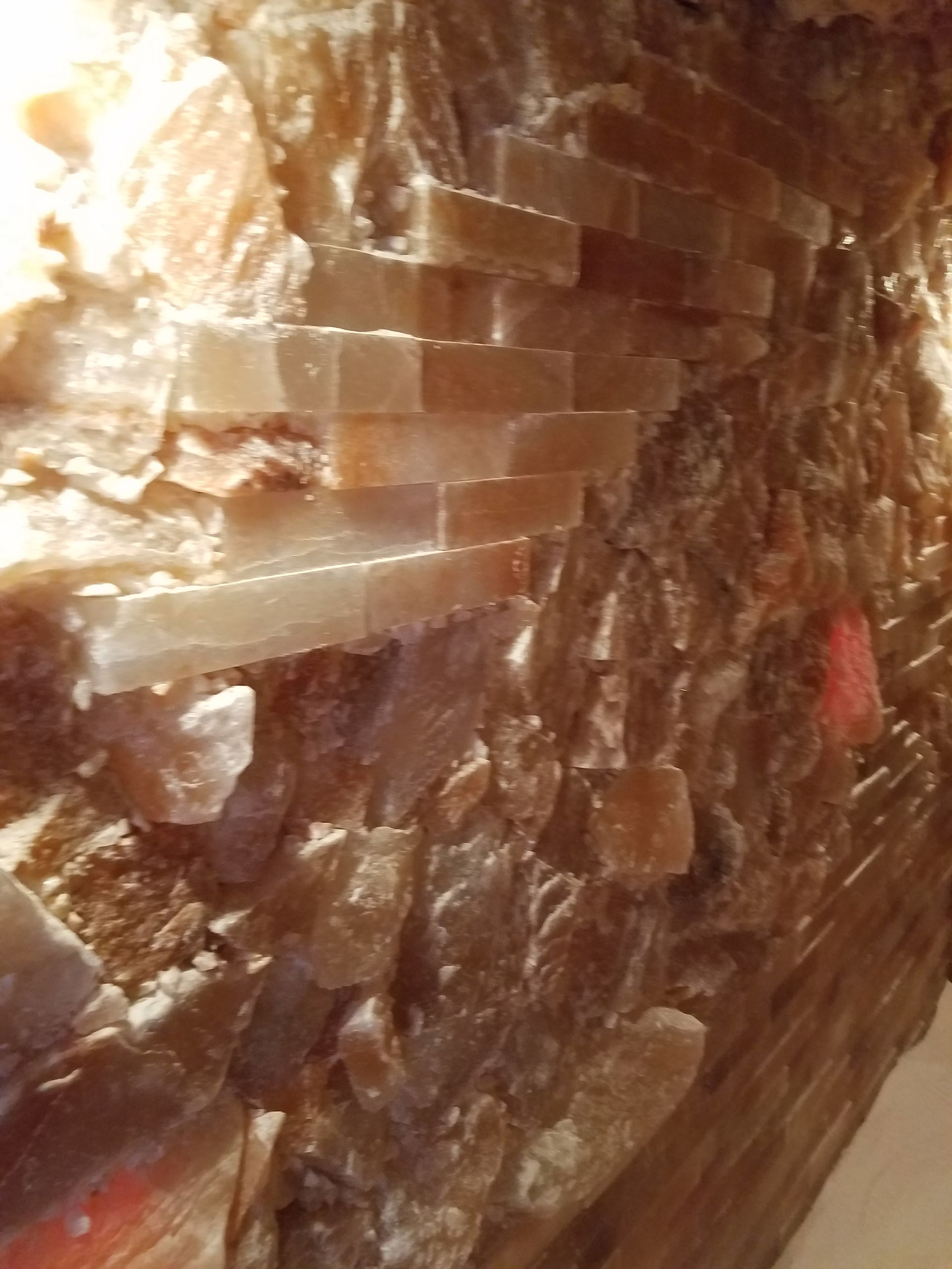 A close up of a piece of brick wall