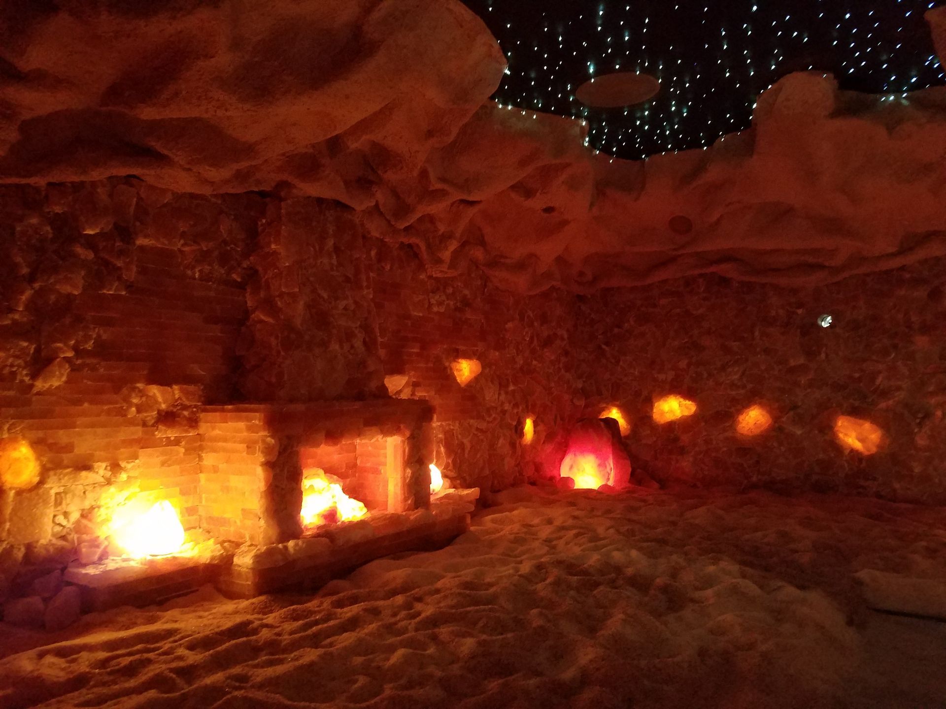 A room with a fireplace and candles in it