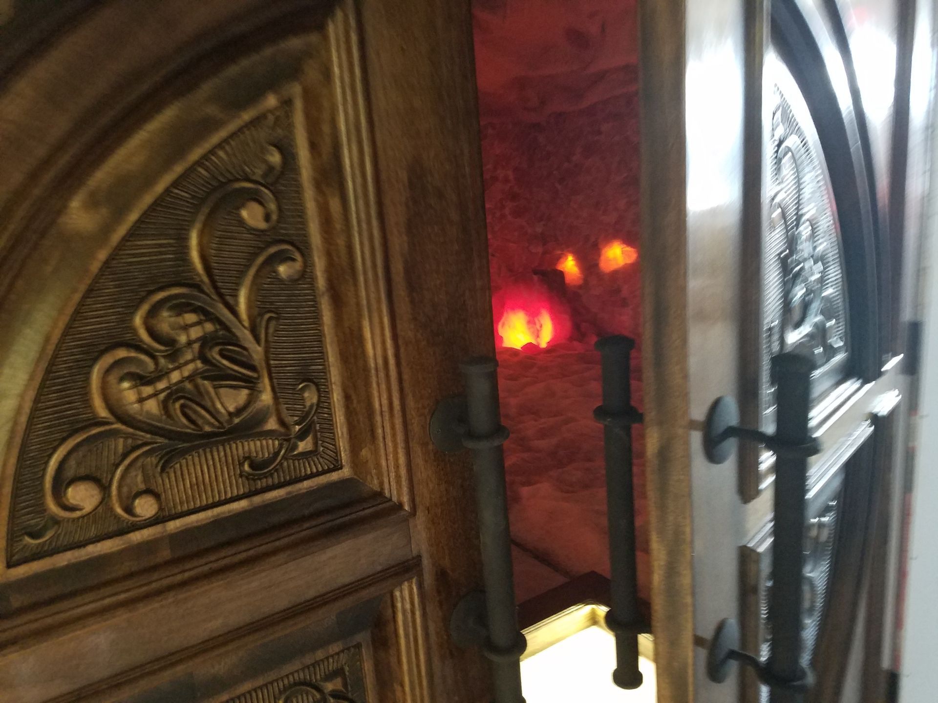 A wooden door with a fancy design on it