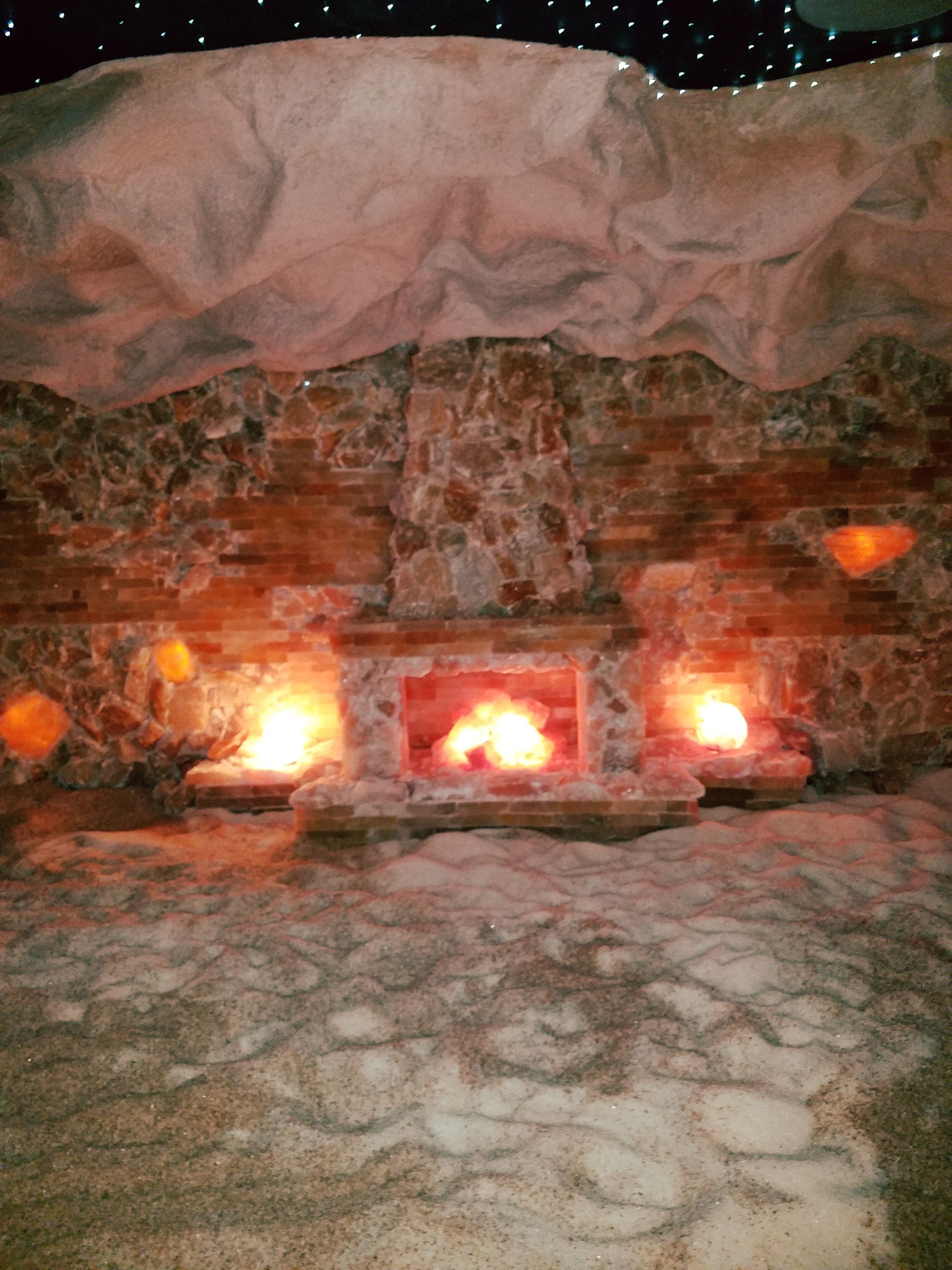 There is a fireplace in the middle of the room.