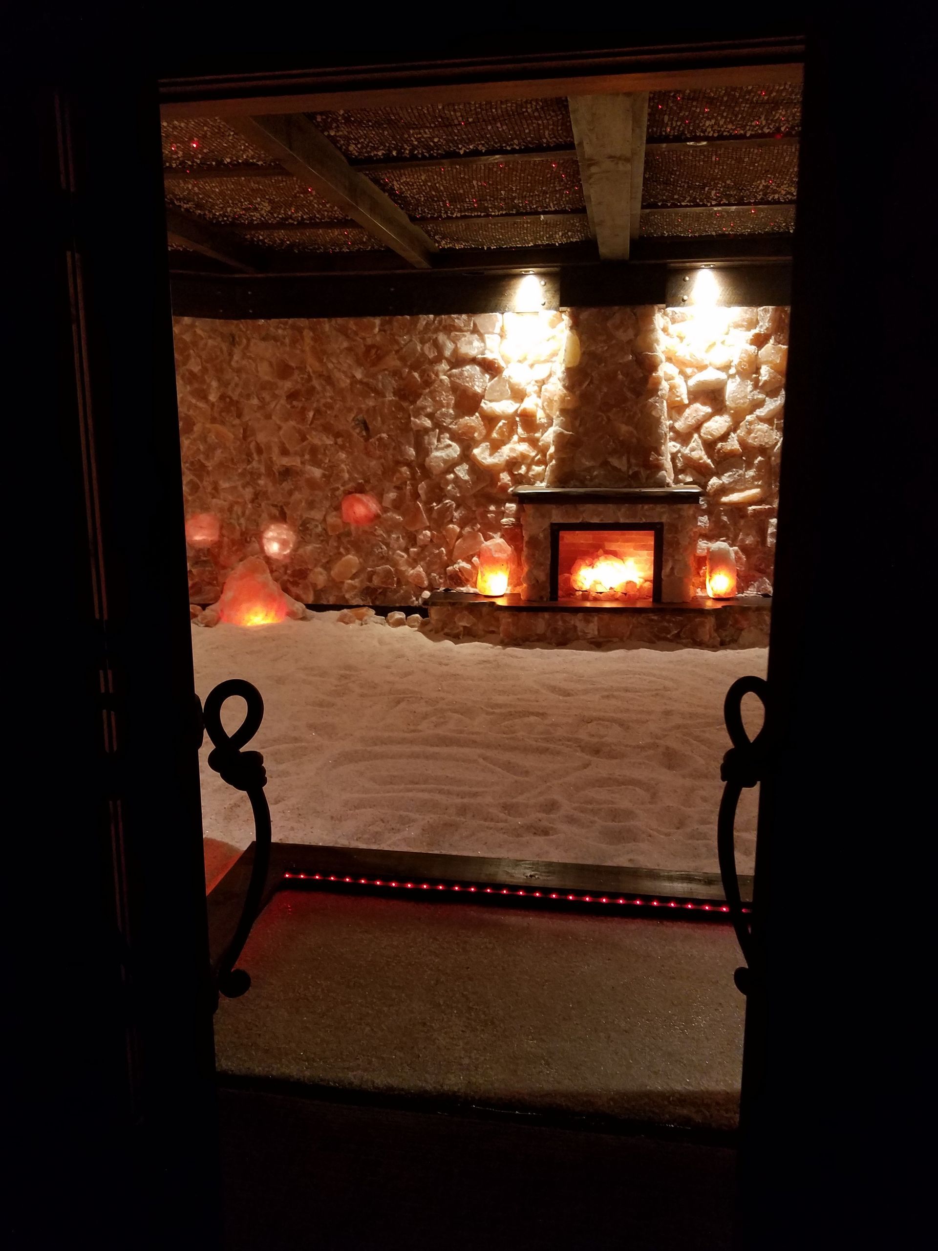 There is a fireplace in the middle of the room.