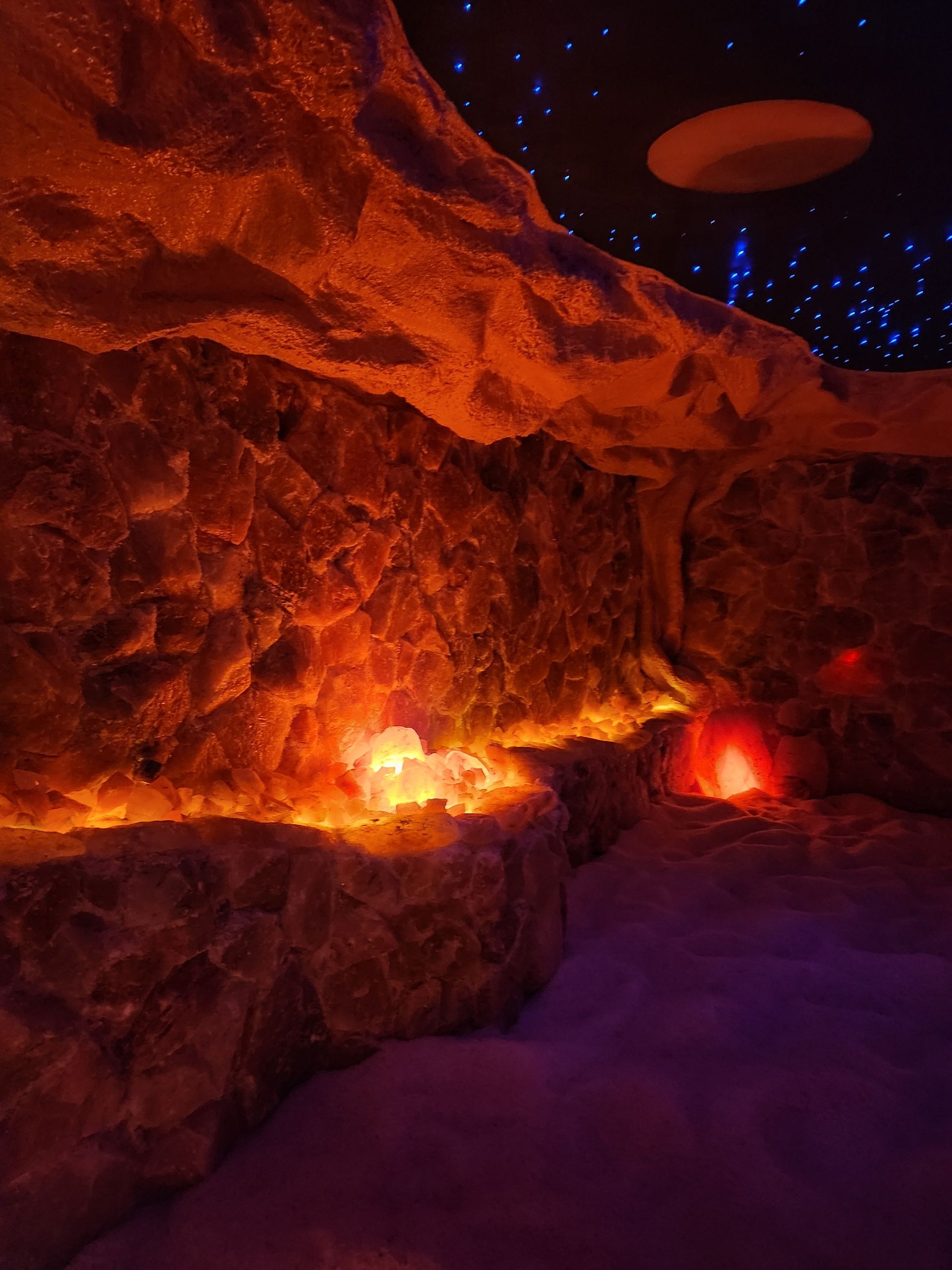 It looks like a cave with a starry sky in the background.