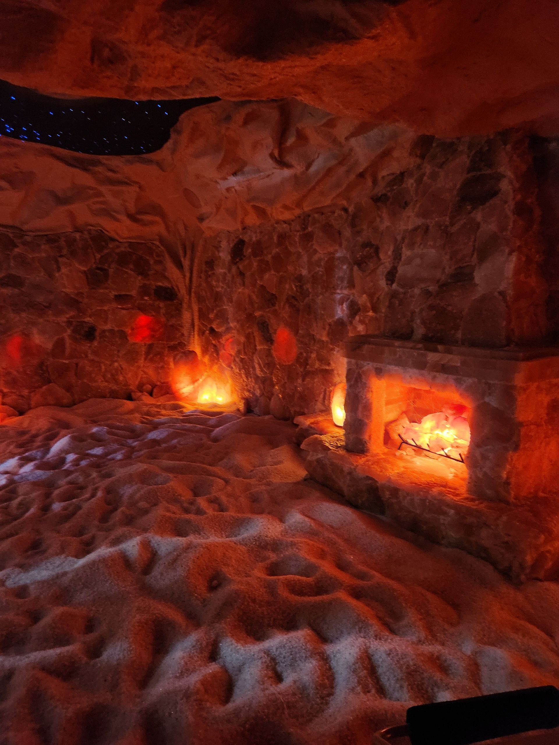 There is a fireplace in the middle of the room.