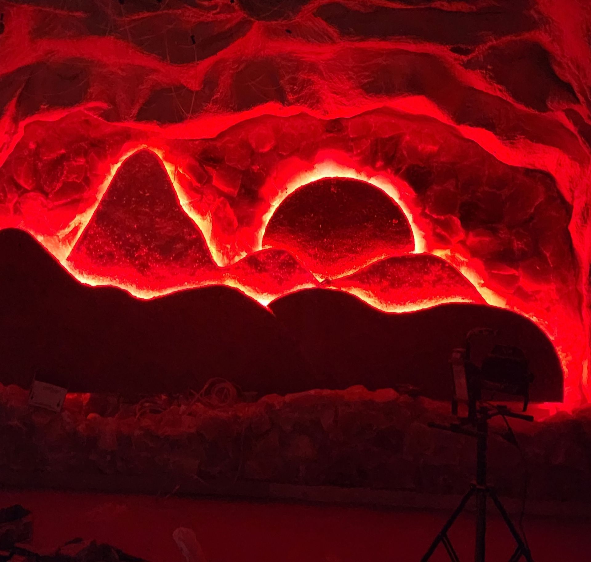 The sun is shining through the mountains in Salt cave.