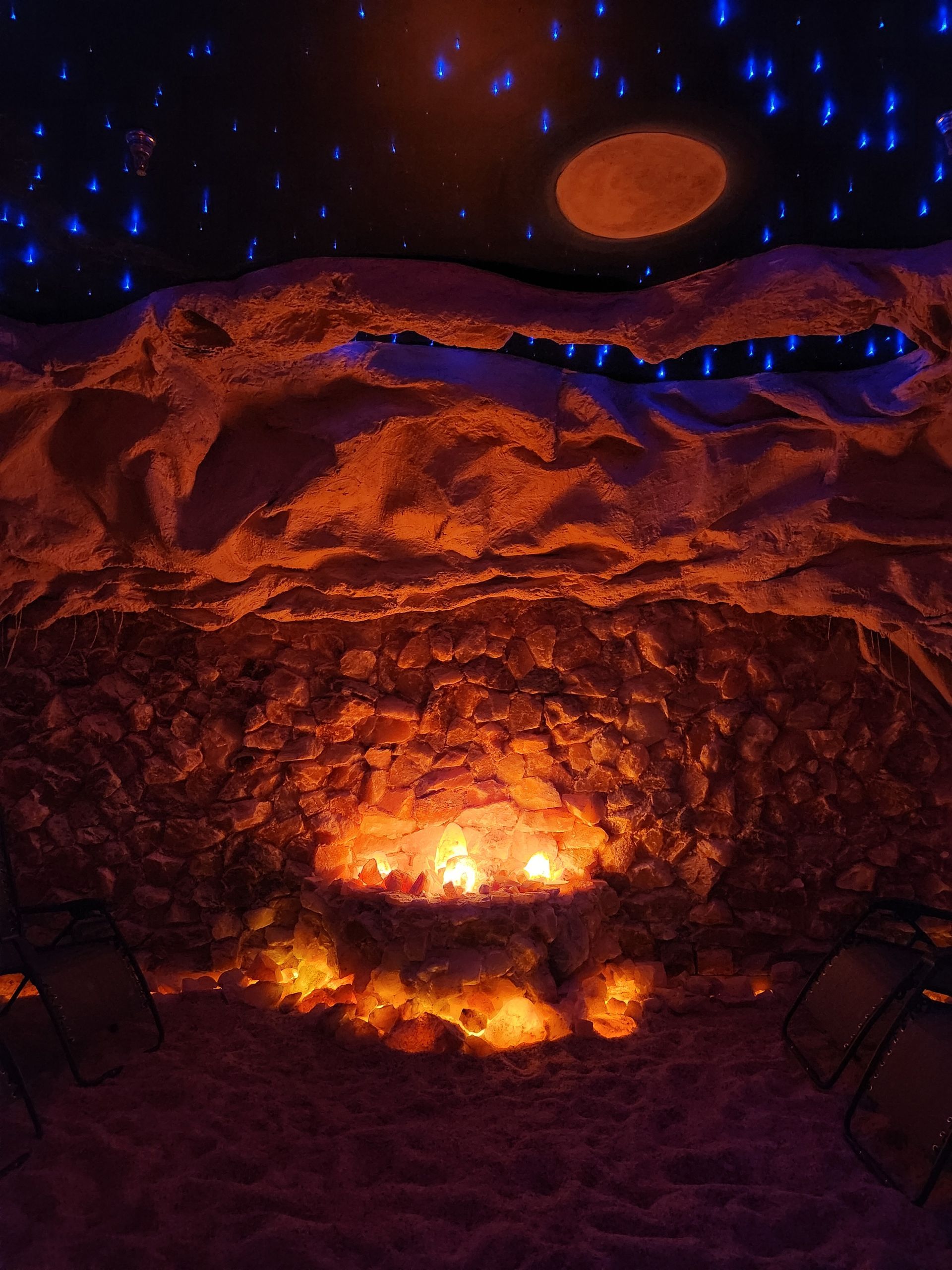 There is a fire in the middle of the room.