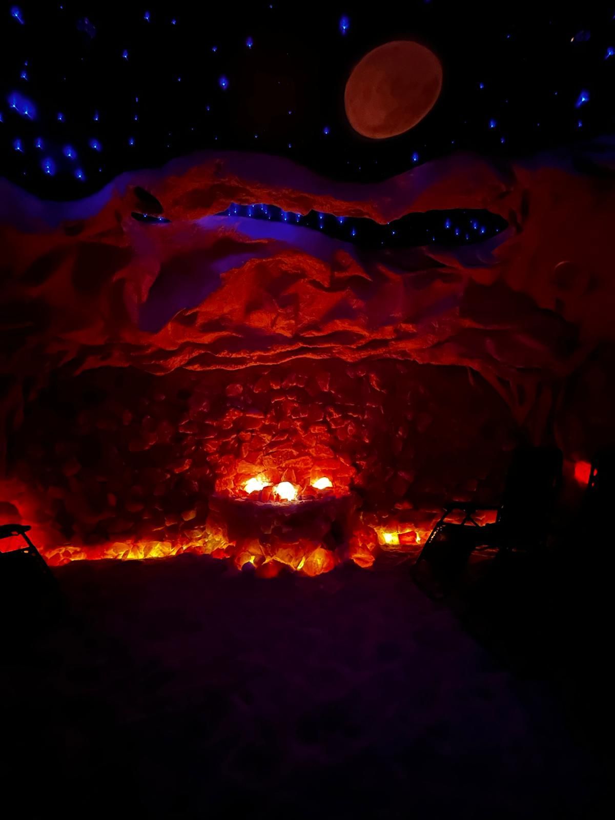 It looks like a Salt cave with a fire pit in the middle of it.