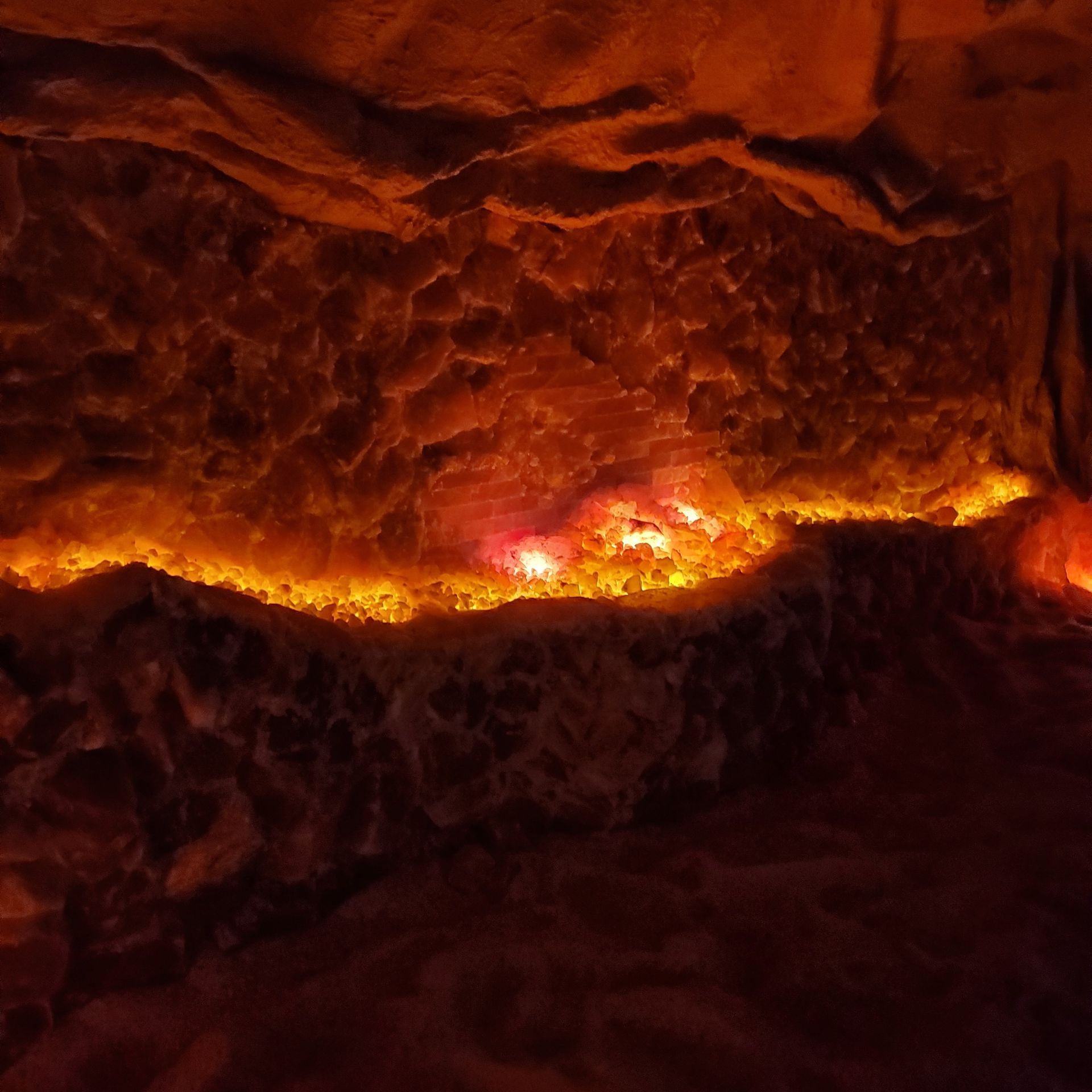 A Salt cave with a lot of fire coming out of it.