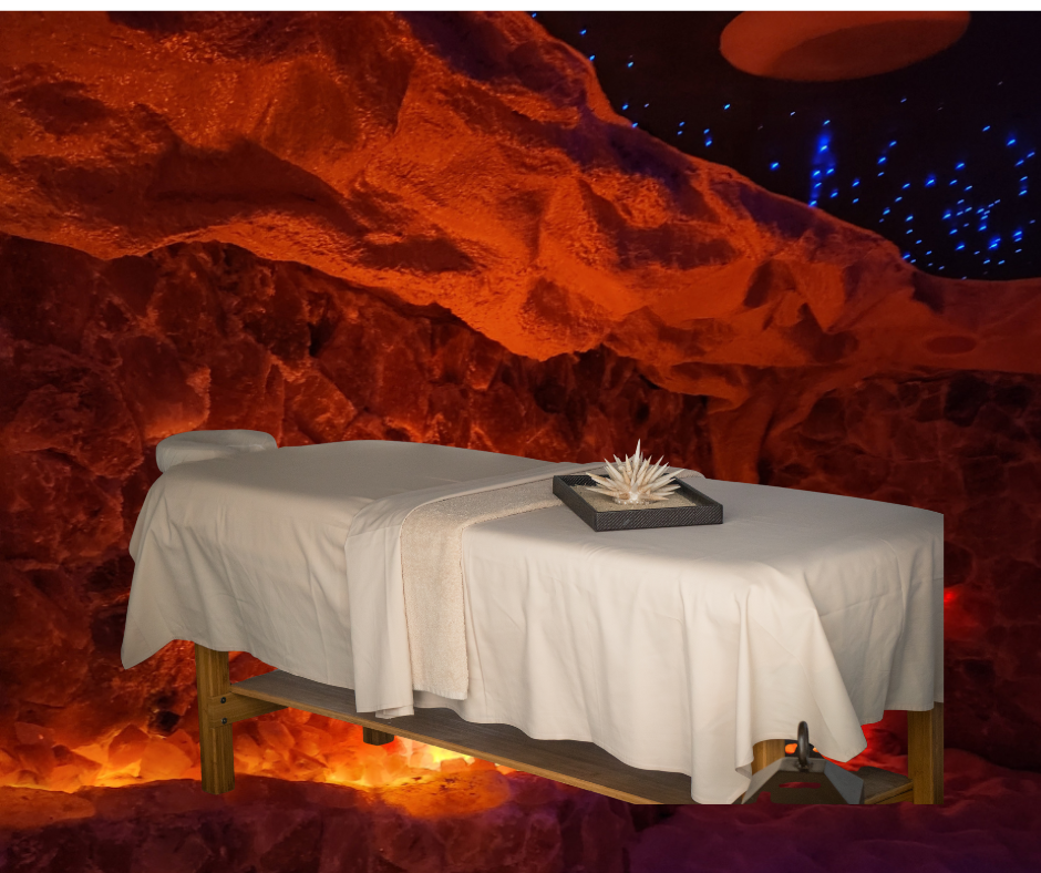 A massage table in a cave with a flower on it