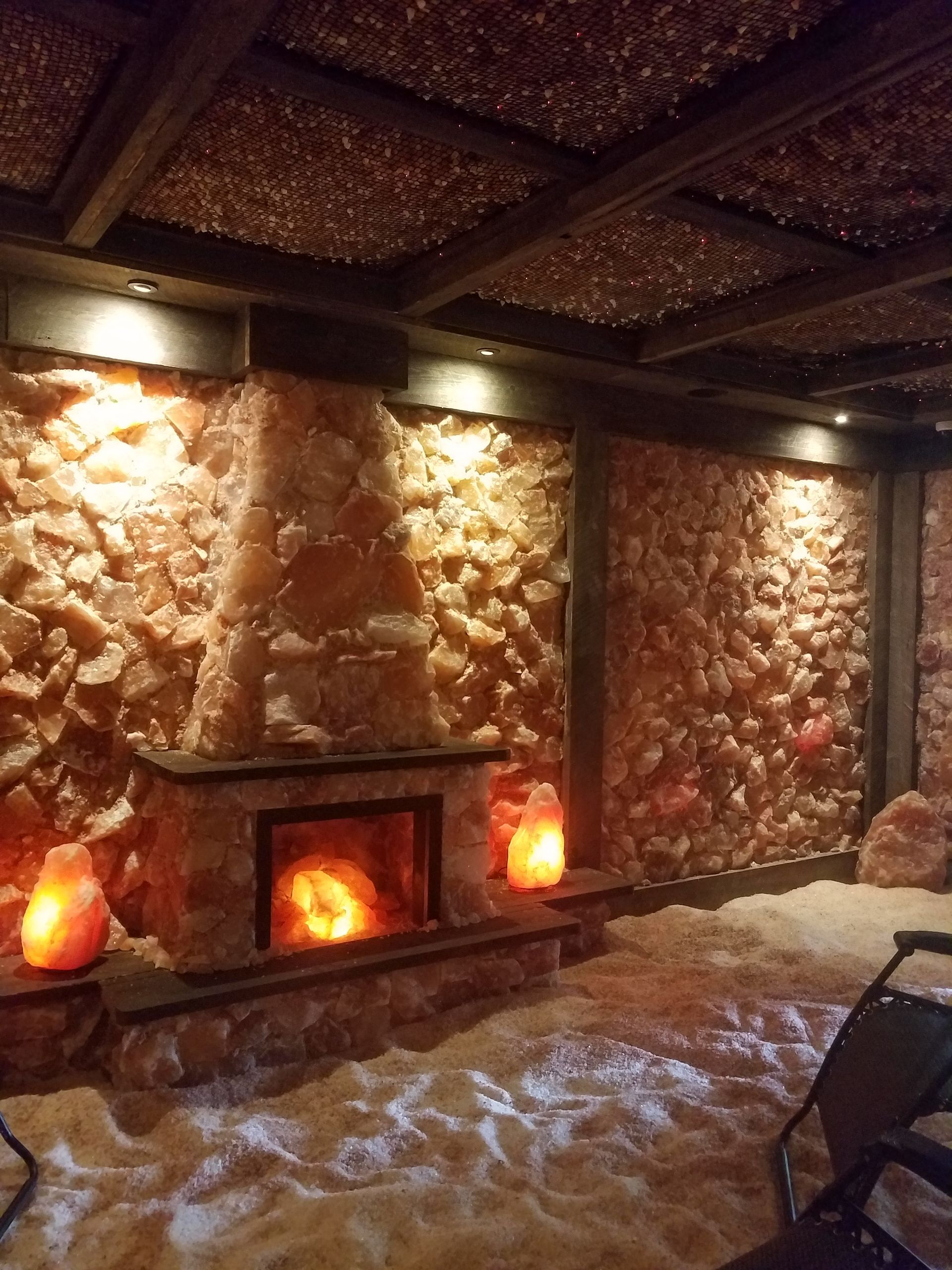 Salt cave with a fireplace and candles in it