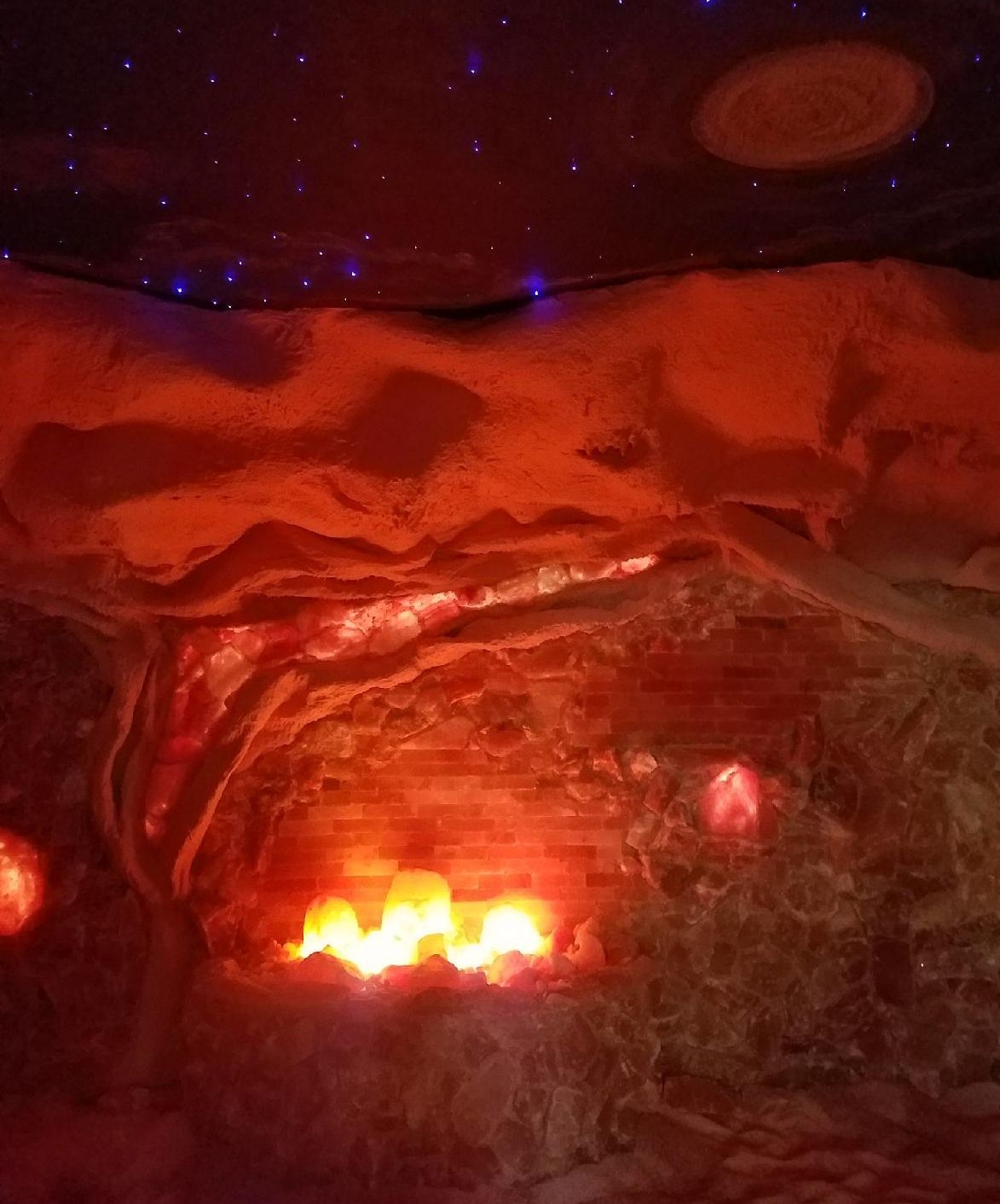 Salt cave with a lot of lights coming out of it.