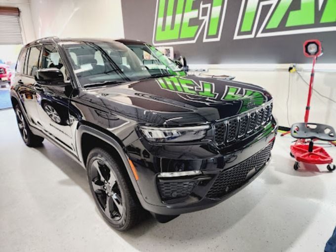 Black Jeep Grand Cherokee inside Wet Paint garage after a professional PPF installation service 