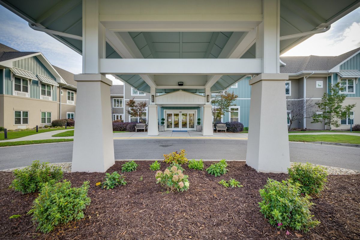A large building with a canopy over the entrance.