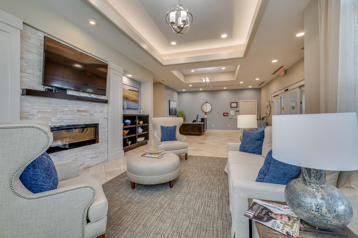 A living room filled with furniture and a fireplace.