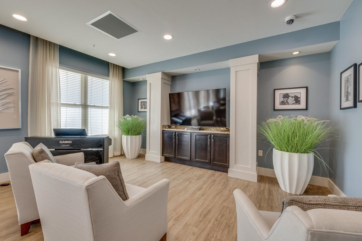 A living room filled with furniture and a flat screen tv.