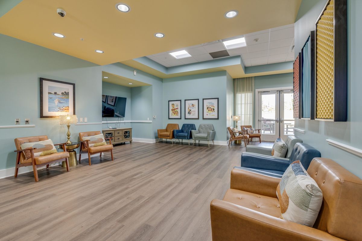 A living room filled with furniture and a television.