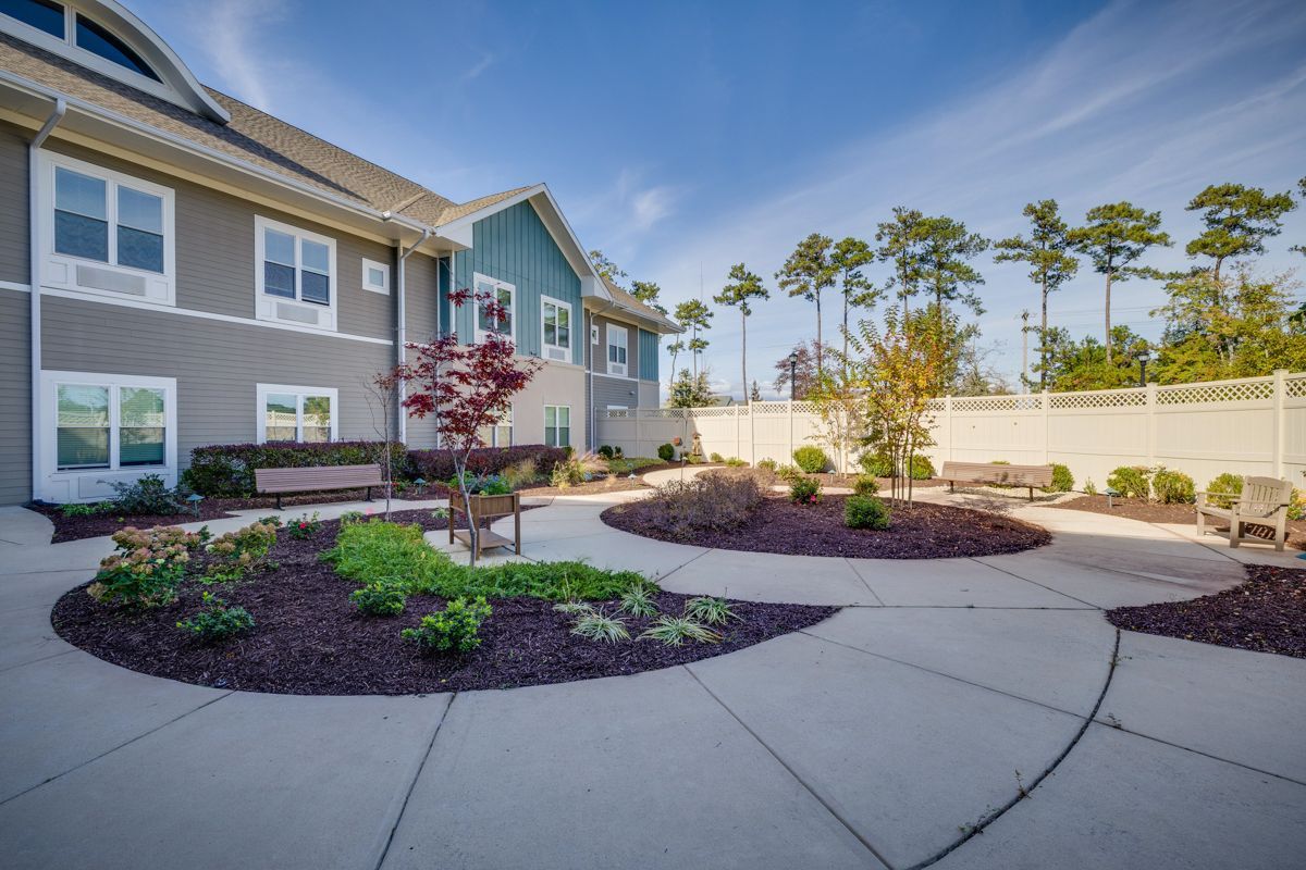 A large house with a circular walkway in front of it.
