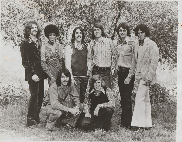 A black and white photo of a group of young men