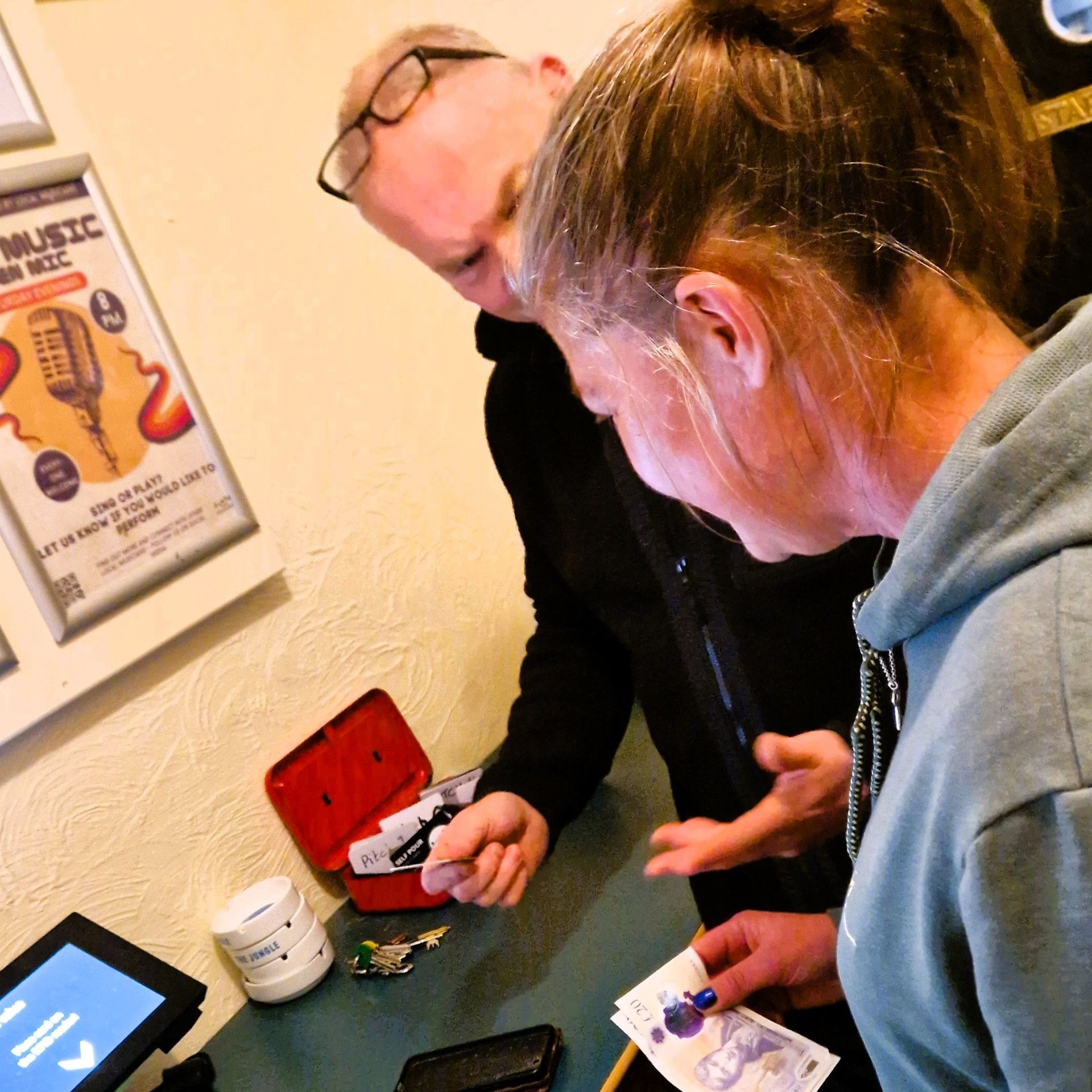 Ian explaining to Sharon how self-pour beer works for her party.