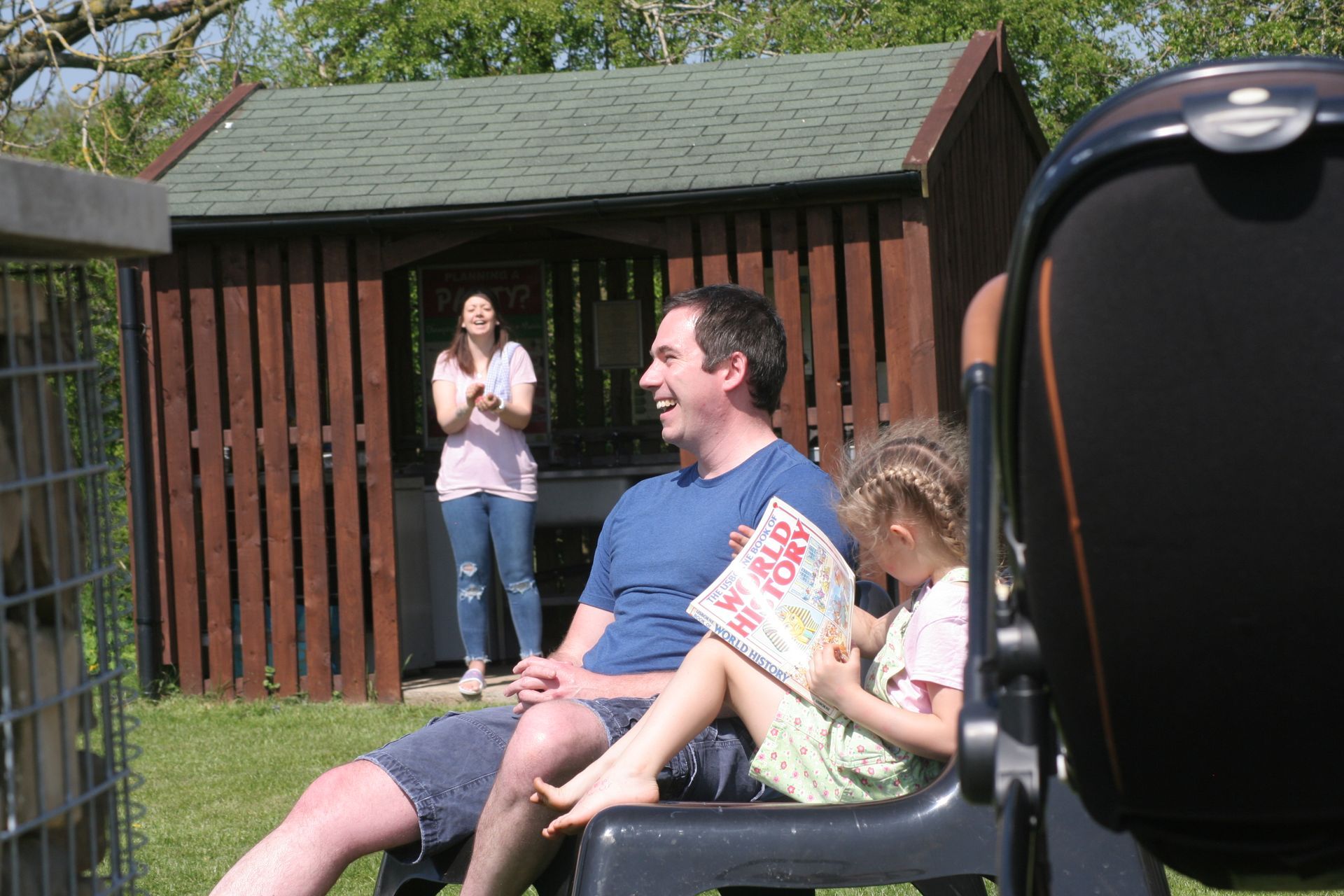 Friends and family in the pod garden with glampers kitchen.