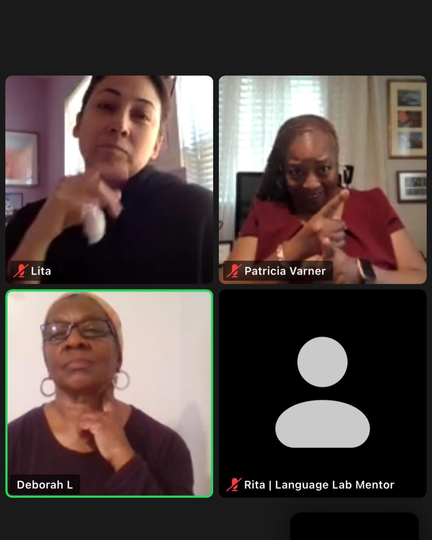 Four people in a video conference, diverse women, some gesturing, discussing.