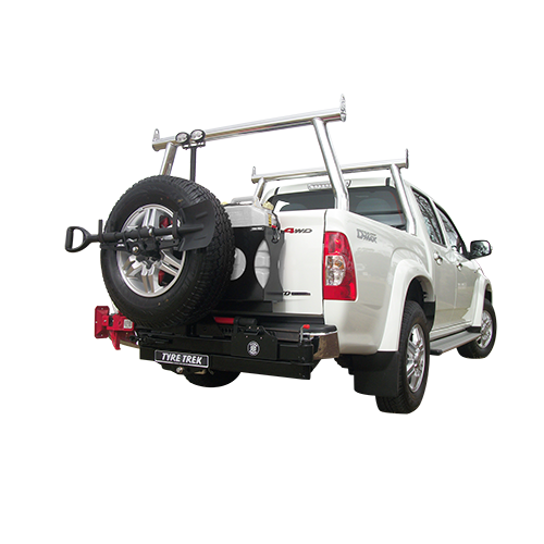 A white 4wd with a tyre trek swing away attached to the back of it.