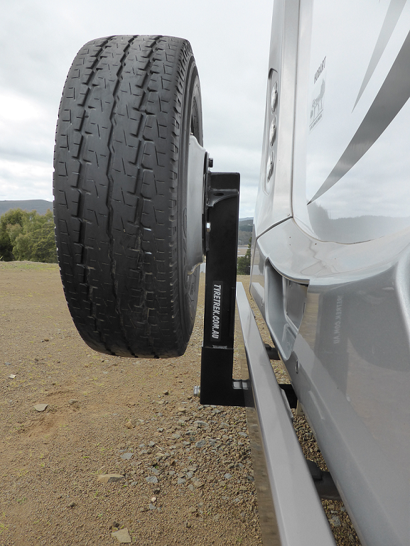 A tyre is attached to the side of a vehicle
