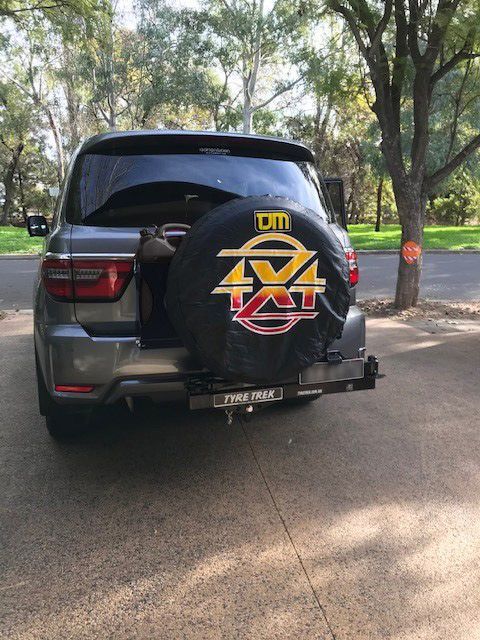 A 4x4 suv is parked on the side of the road