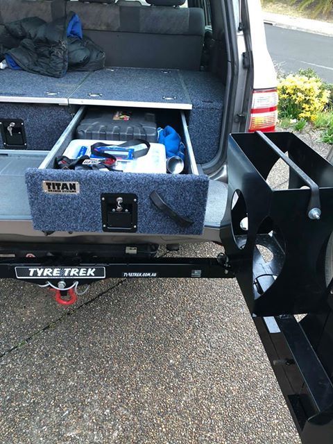 A car with a drawer in the back of it.