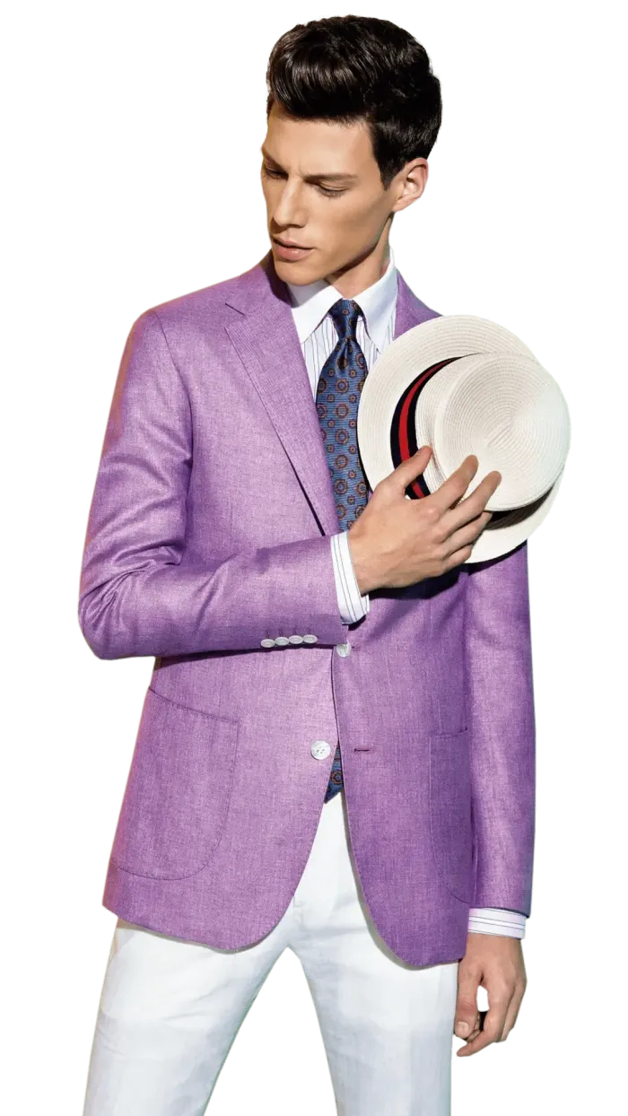 A man in a purple jacket and white pants is holding a hat.