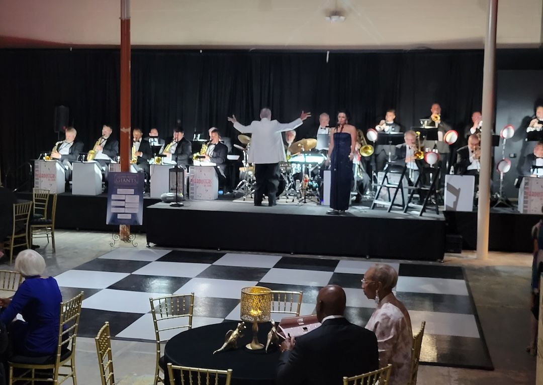 Checkered dance floor and stage with band