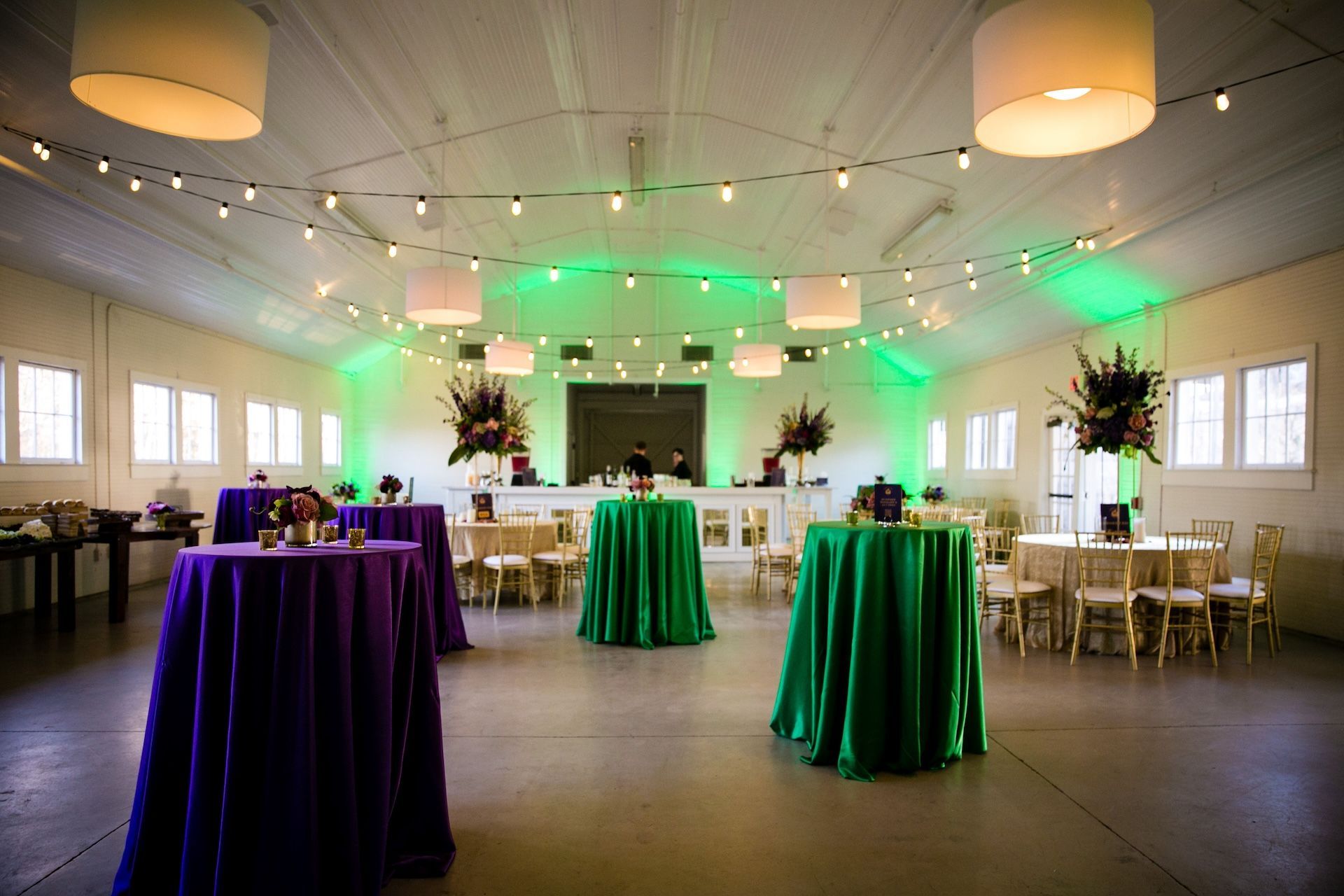 green purple corporate holiday party with lights