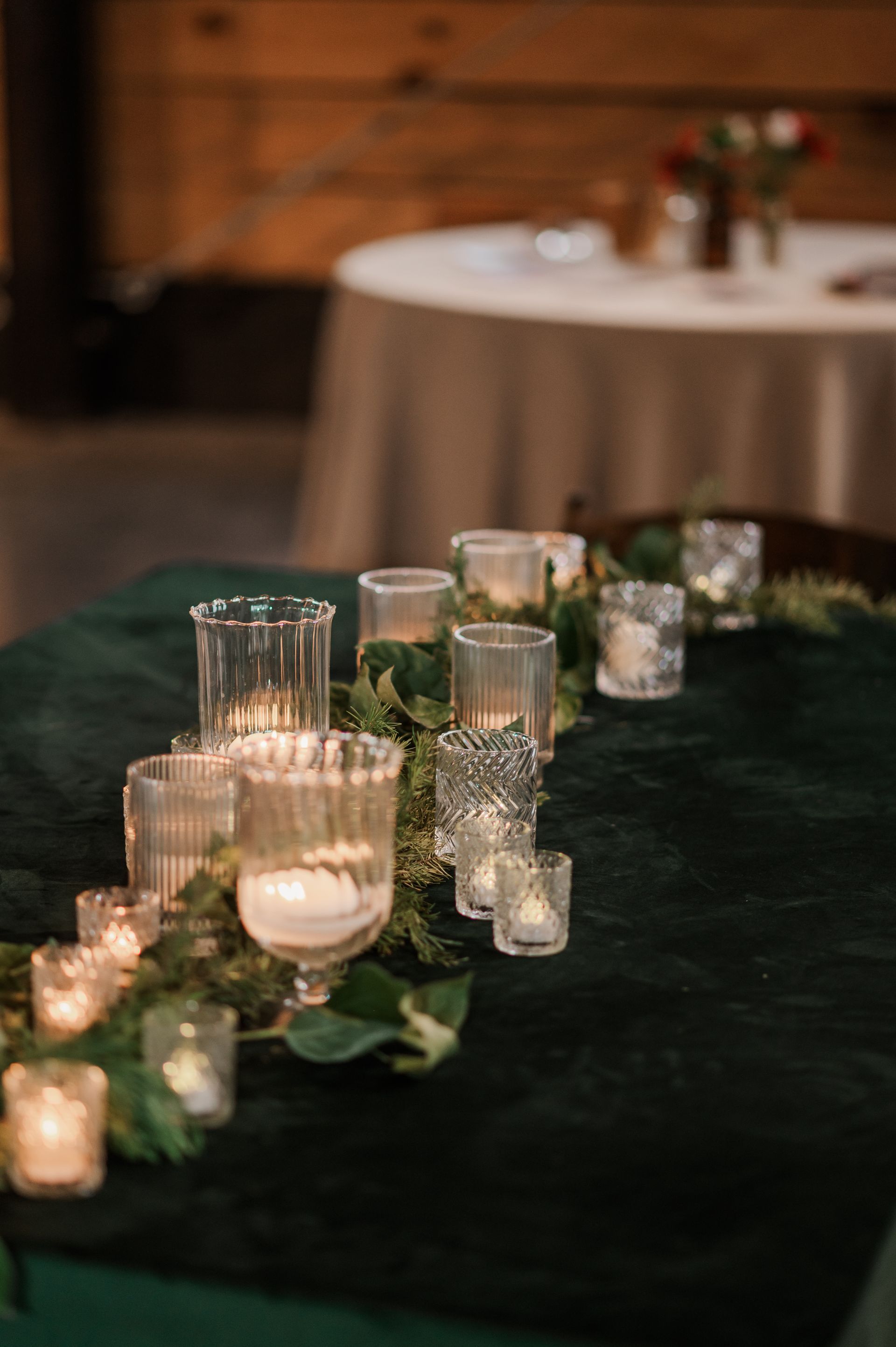 candles on green velvet tablecloth