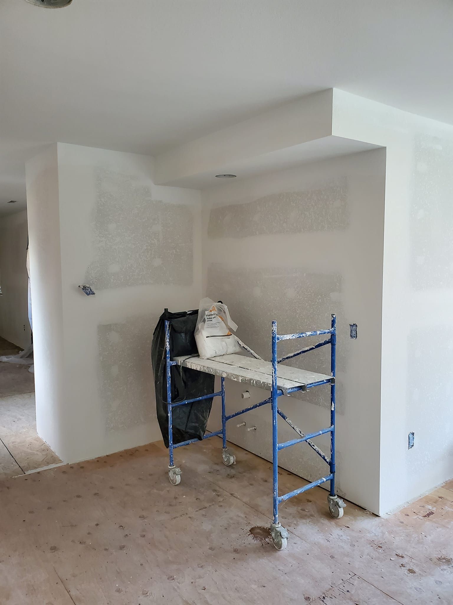 A room with a scaffolding and a helmet on it.