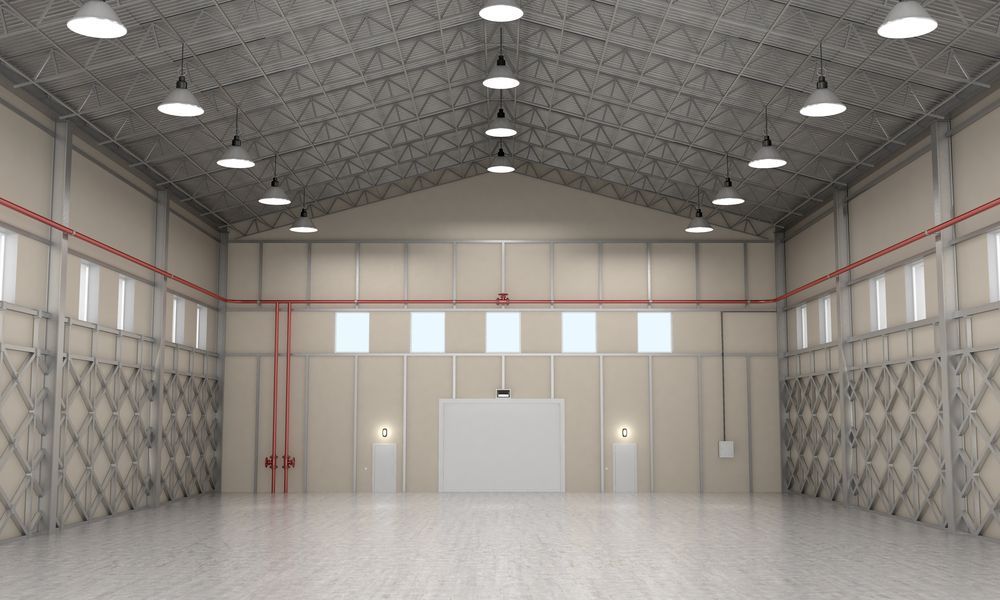 Empty Industrial Warehouse With Overhead Lights, Metal Beams — Lit Energy in Bloomsbury, QLD