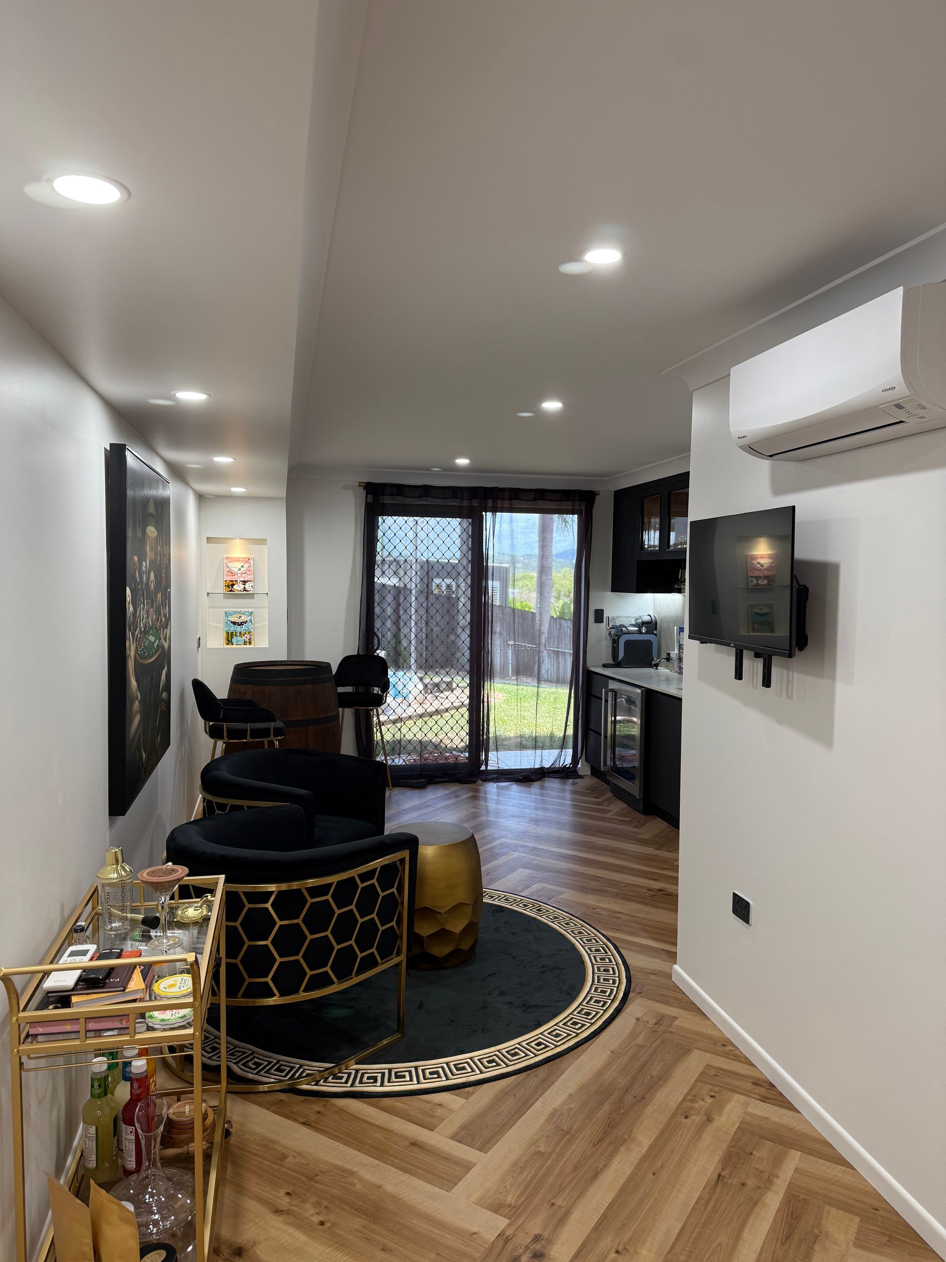 Dark Ceiling Fan Centered on a Gray Room Ceiling — Lit Energy in Seaforth, QLD