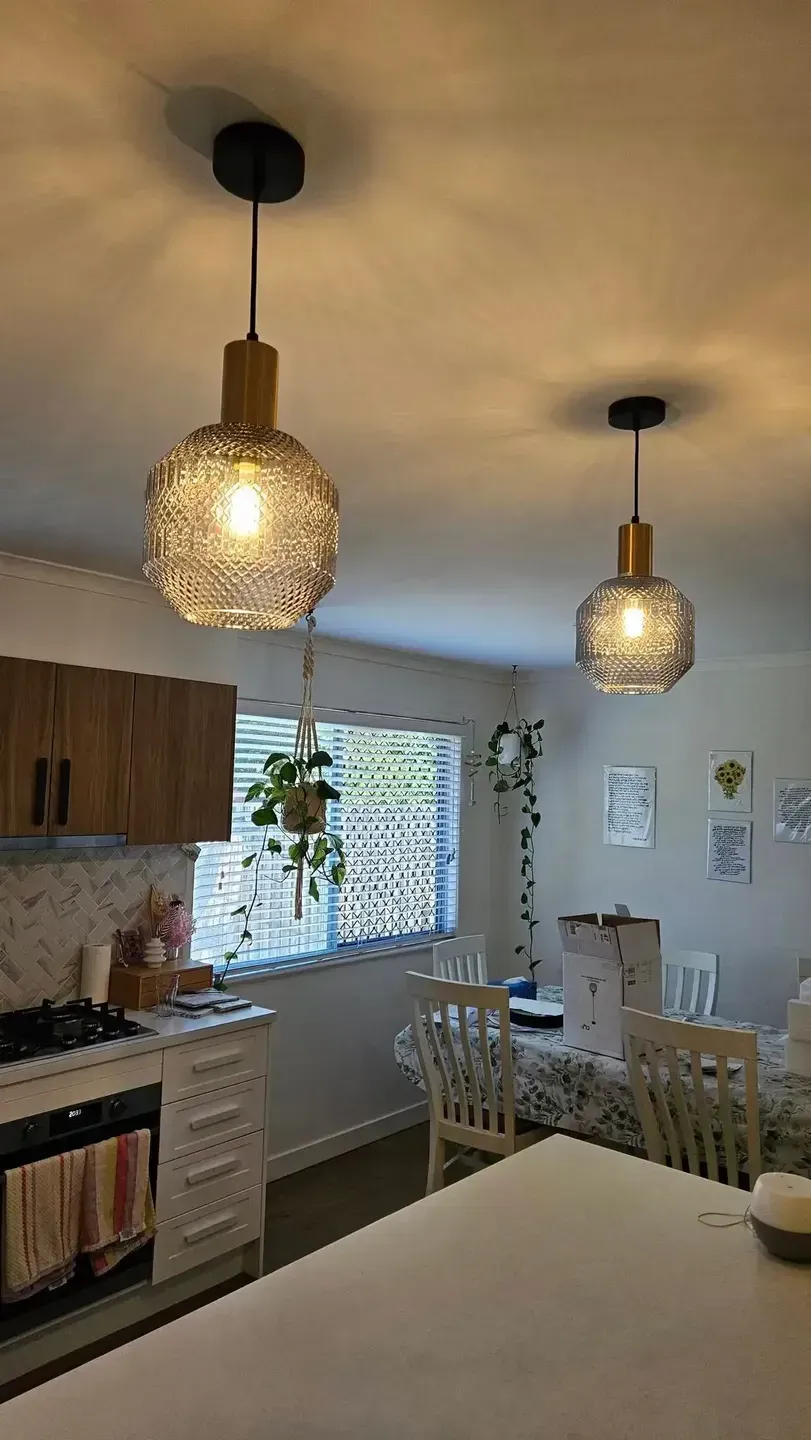 Two Pendant Lights Hang Above a Kitchen Island — Lit Energy in Seaforth, QLD