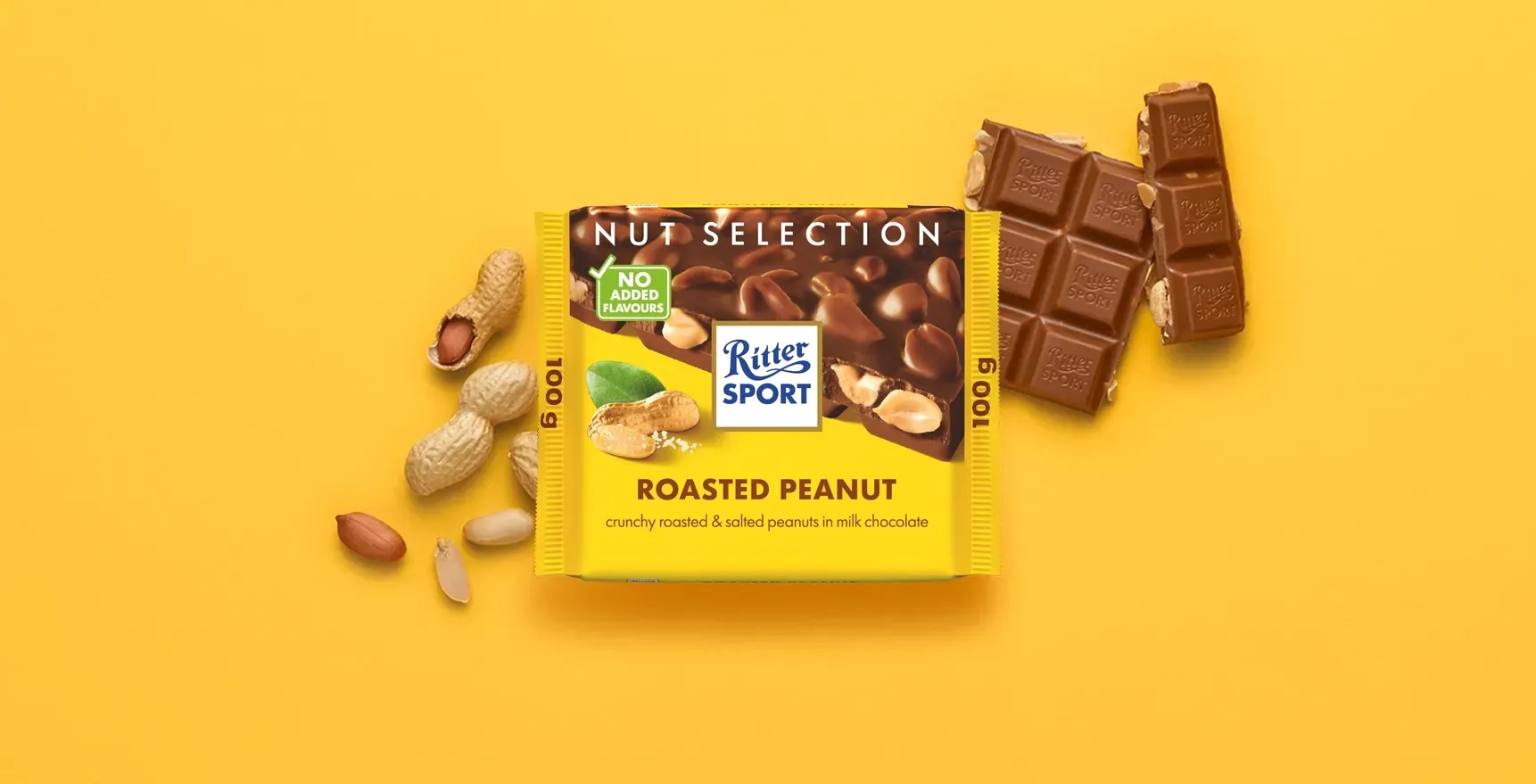 Ritter Sport chocolate bar packaging with cocoa beans, broken chocolate, and milk on a blue background.