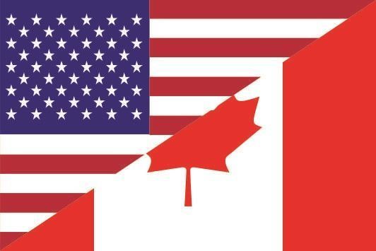 An american flag and a canadian flag with a maple leaf in the middle.