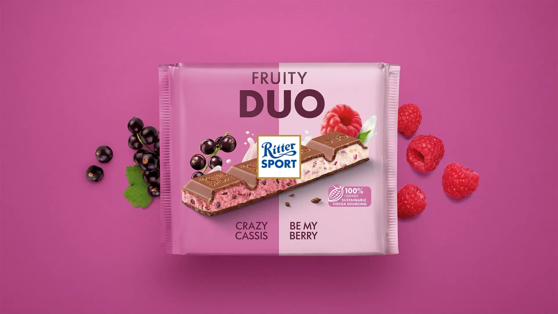 Ritter Sport chocolate bar packaging with cocoa beans, broken chocolate, and milk on a blue background.