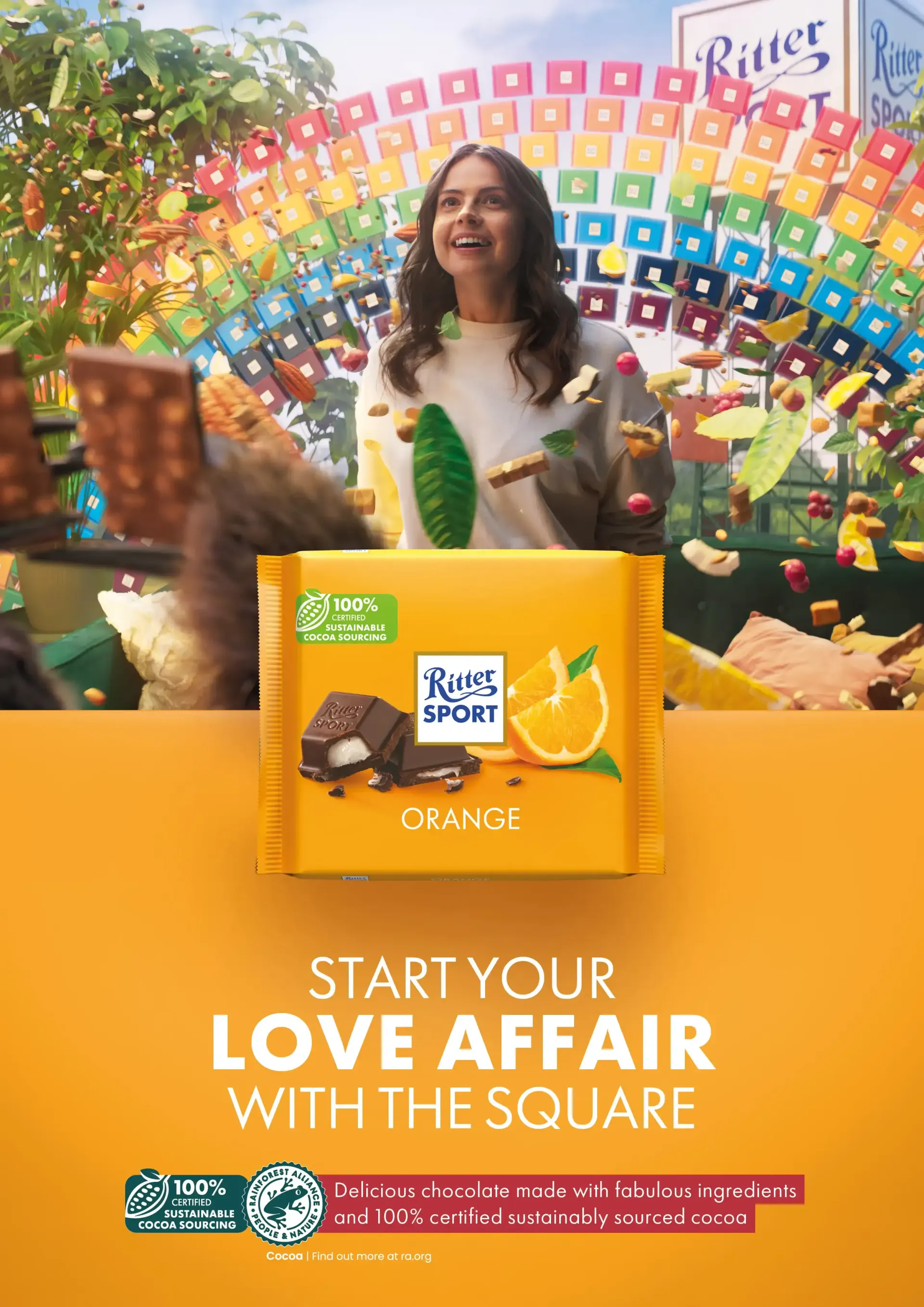 Woman smiling with Ritter Sport orange chocolate bar; colorful square backdrop.