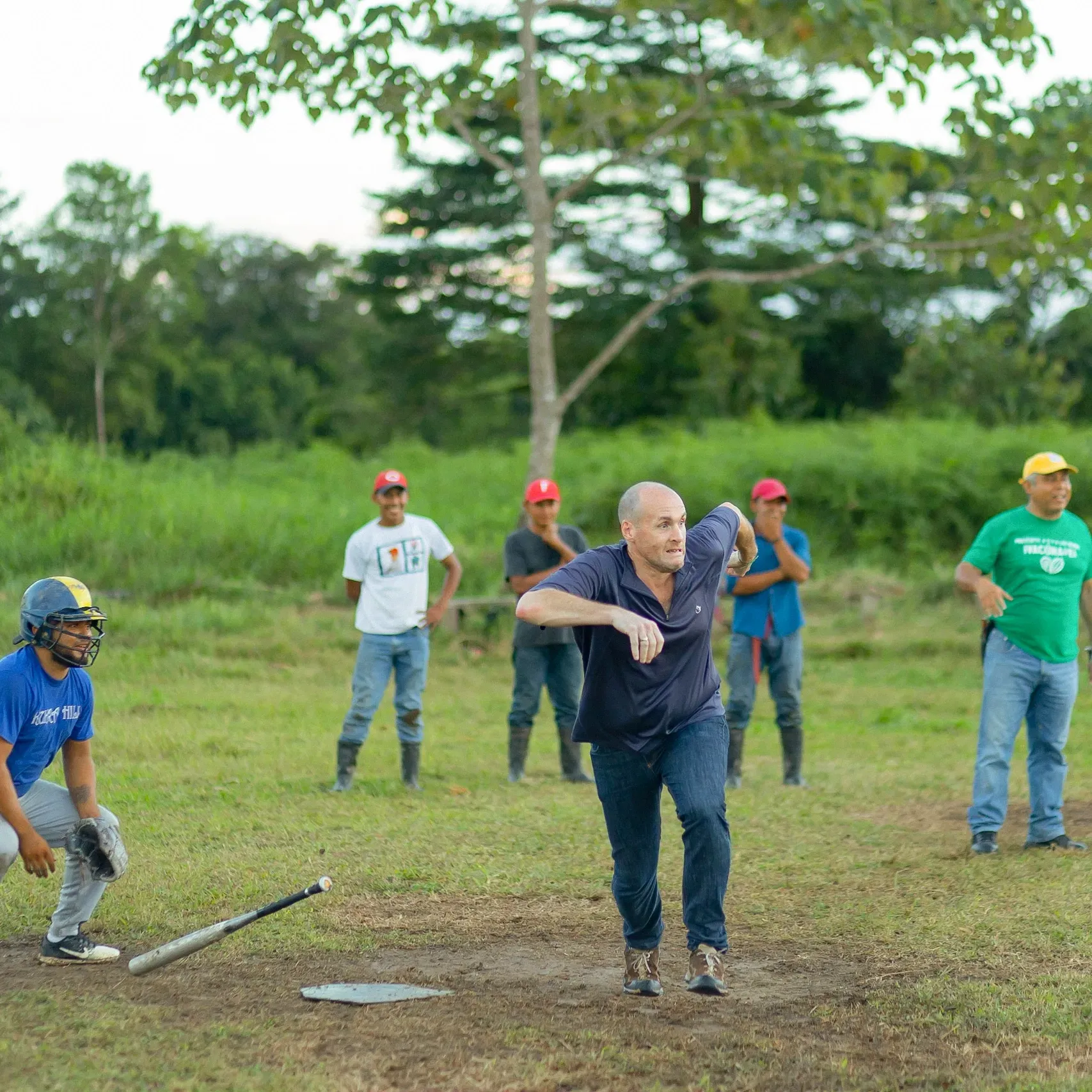 Men playing baseball on a field.